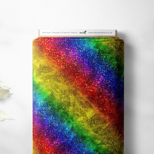 May include: Rainbow fabric with a textured, brushed look and gold glitter accents.  Discover Lifestyle & Fashion Fabrics www.discoverdirect.co.uk