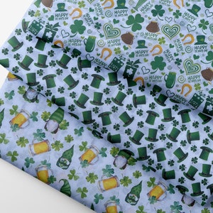 May include: Pale blue wrapping paper with a St. Patrick's Day design. The pattern includes green leprechaun hats, shamrocks, beer glasses, and gnomes. The words "Happy St. Pat's Day" are also printed on the paper.