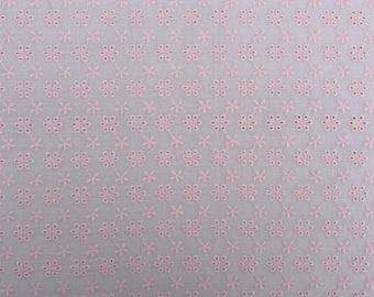 May include: A close-up of a light pink fabric with a repeating pattern of small, embroidered flowers. The fabric has a delicate and feminine look.