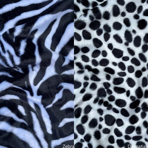 May include: Close-up of black and white zebra and dalmatian print fabrics. The zebra print has thin black stripes on a white background. The dalmatian print has black spots on a white background.