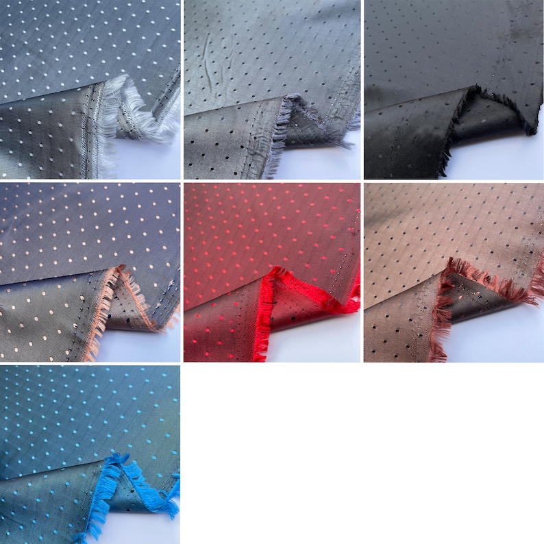May include: A selection of fabric samples in different colours, each displaying a polka dot design. The fabrics include shades of grey, black, red, and blue, with a fringed edge. The dots are small and evenly spaced across the material.