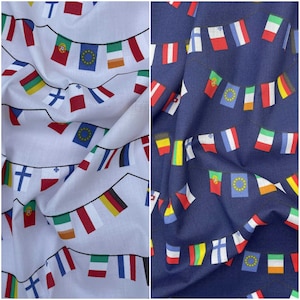 May include: Two fabric swatches featuring a repeating pattern of flags from different countries. The flags are arranged in a string pattern. One swatch is white with a blue background for the flags. The other swatch is navy blue with a white background for the flags.