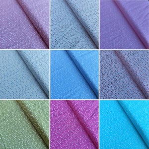 May include: A collection of fabric swatches with a small white heart pattern on a variety of colored backgrounds, including pink, blue, green, and purple.