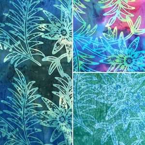 May include: A collage of three fabric squares featuring a blue and green floral pattern. The fabric has a watercolour effect with shades of blue, green, and pink.