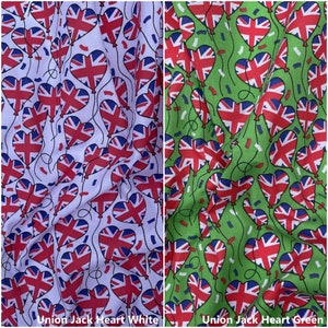 May include: Two fabric swatches with a repeating pattern of Union Jack heart-shaped balloons. The fabric on the left is white with red, white, and blue balloons. The fabric on the right is green with red, white, and blue balloons.