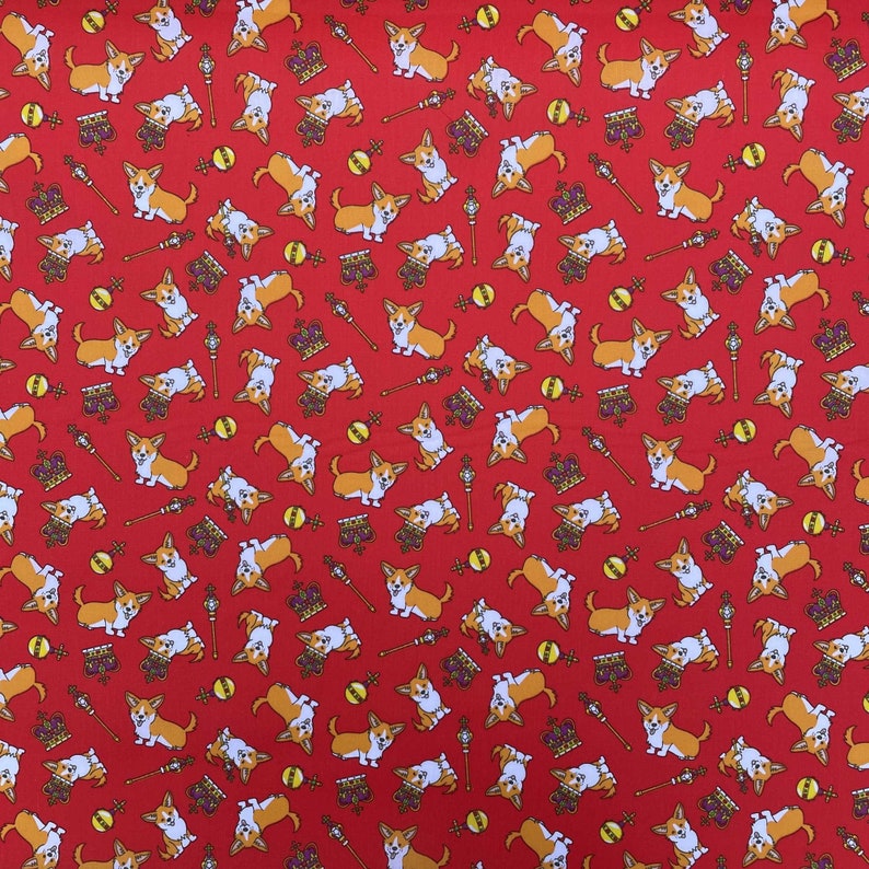 May include: Red fabric with a repeating pattern of white and brown corgi dogs, gold crowns, and scepters. The corgis are wearing gold crowns and holding scepters.