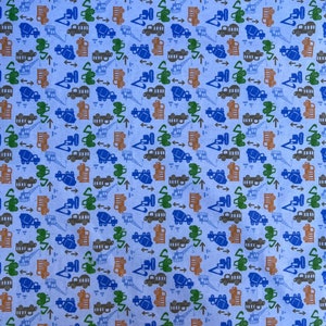 May include: A blue fabric with a repeating pattern of construction vehicles. The vehicles are in shades of blue, green, brown, and orange. The pattern includes arrows pointing up and to the right.