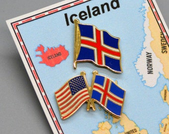May include: Two crossed flag pins, one American and one Icelandic, on a map of Europe with the word "Iceland" at the top.