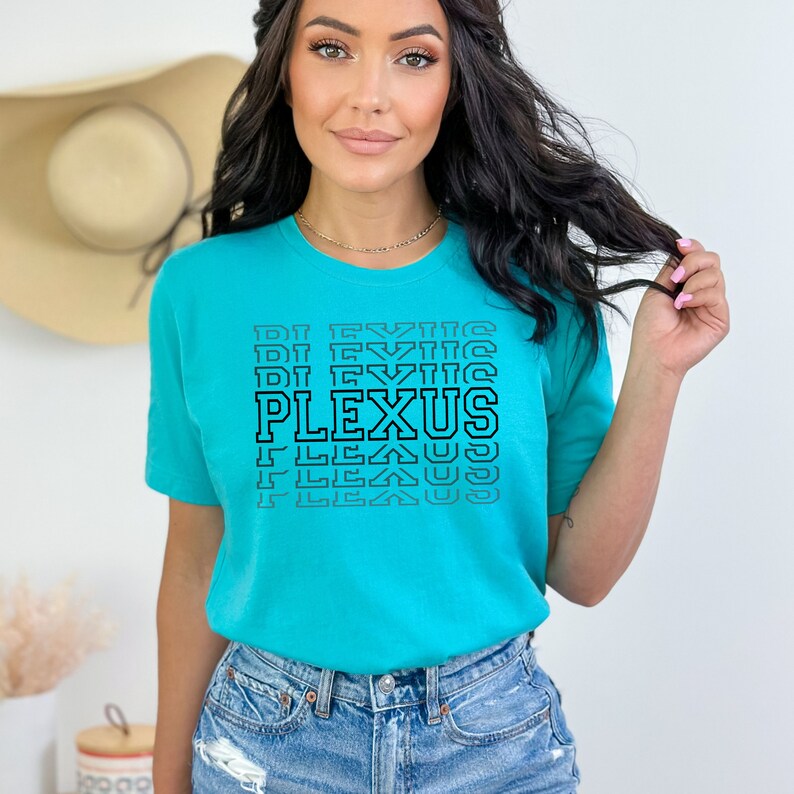 May include: A turquoise blue t-shirt with a black graphic that says "PLEXUS" in a repeating pattern.