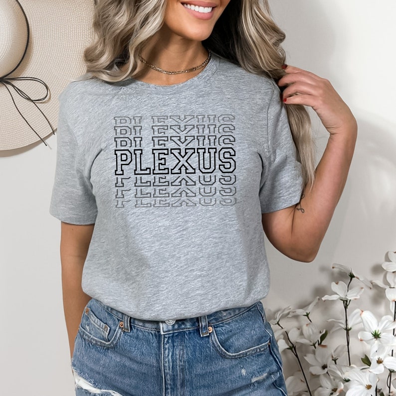May include: Grey short-sleeved t-shirt with a black graphic print of the word "PLEXUS" repeated in a stacked, staggered pattern.