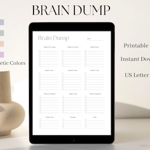 May include: A digital planner displayed on a black tablet. The planner, titled "Brain Dump," features sections for tasks, appointments, and notes. The image also shows four pastel color swatches and text that reads "Printable PDF," "Instant Download," and "US Letter & A4."