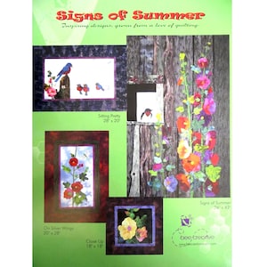 May include: A promotional flyer titled Signs of Summer featuring four quilt designs. The images display blue birds, vibrant hollyhock flowers, and a dragonfly. Text includes Sitting Pretty 28" x 20", On Silver Wings 20" x 28", and Signs of Summer 26" x 42".