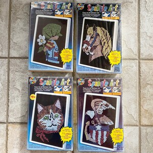 May include: Four vintage "Spangle Art" kits. Each kit features a black background with a spangle art design of a boy, horse, kitten, and eagle. The kits are in their original packaging, with the "Spangle Art" logo and text.