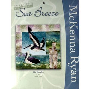 May include: A quilt pattern titled "Sea Breeze" by McKenna Ryan. The design features two pelicans, one in flight and one resting, with a backdrop of water and wooden posts. The block measures 12 x 12 inches.