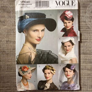 May include: Vogue Accessories pattern VP690 featuring illustrations of vintage hats. The cover showcases a woman wearing a large, dark blue hat with a decorative embellishment. Additional hat designs include a pink feathered hat, a white hat with a veil, and others.