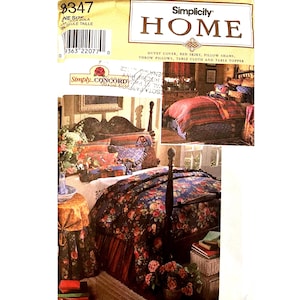 May include: A Simplicity Home sewing pattern envelope 8347 for a duvet cover, bed skirt, pillow shams, throw pillows, table cloth, and table topper. The packaging features a photograph of a bed with a dark floral duvet and a matching bed skirt.