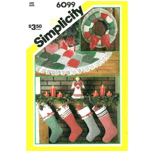 May include: Simplicity 6099 sewing pattern envelope featuring instructions for a patchwork Christmas tree skirt with lace trim, a matching fabric wreath with a red bow, and four holiday stockings with decorative ribbon and lace accents.