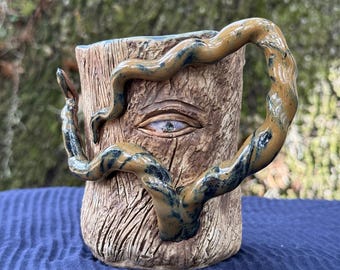Handmade Ceramic Pottery mug with eye and wooden texture one of a kind with twisted handle