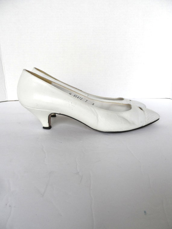 white leather kitten heel pumps