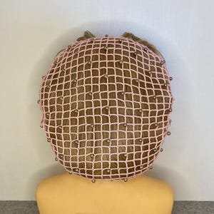 Thinner handmade crochet beaded snood/ hairnet/ filet à cheveux in pink with light brown shiny beads.