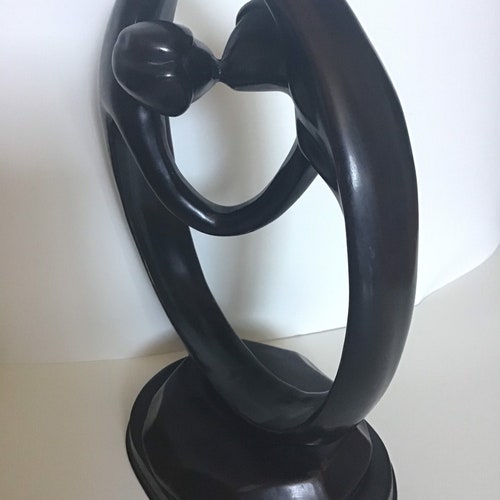 Vintage coated metal couples sculpture man woman kissing love circle buying