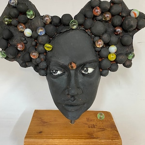 Ceramic mask  with glass balls