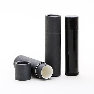 May include: Three black tubes, two are cardboard and one is plastic. The cardboard tubes are open at one end and have a white interior.