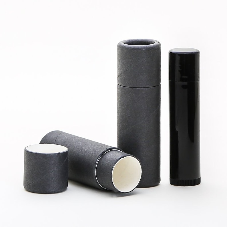 May include: Three black cardboard tubes with white interiors. Two of the tubes are closed, and one is open, revealing the white interior. The tubes are all the same size and shape.