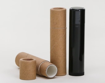 May include: Three cardboard tubes for lip balm or other small items. Two are brown and one is black.