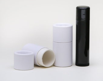 May include: Three white cardboard tubes for lip balm or other small products. One tube is open, showing the white interior. A black tube is also included.