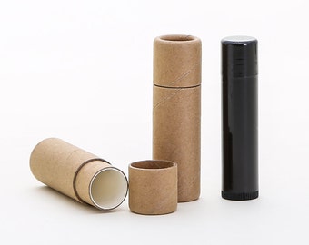 May include: Three cardboard tubes for lip balm or other small items. Two are brown and one is open, revealing a white interior. The third tube is black.