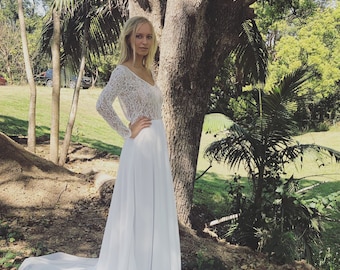 Divine Queen Lace long sleeve, low back wedding dress with train.