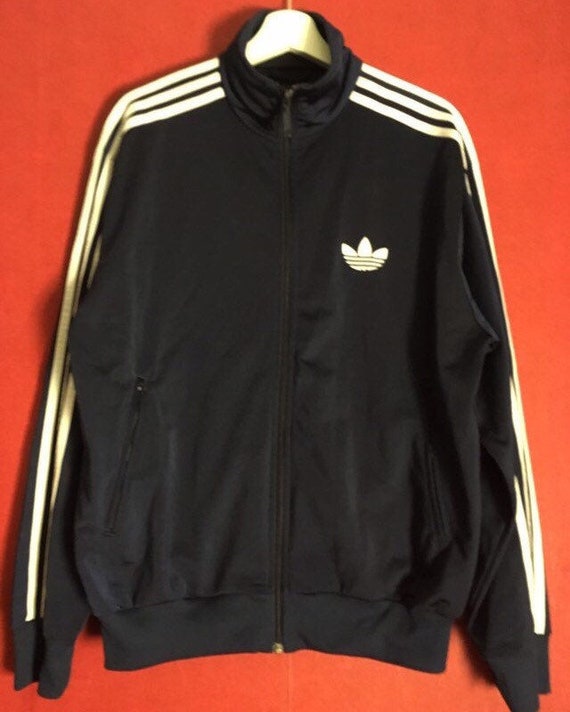 white adidas jacket with blue stripes
