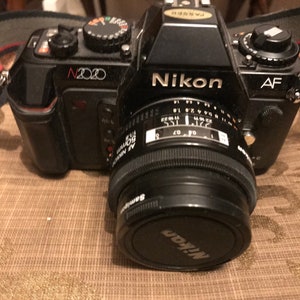 Nikon F-2020 body and 50mm lense Free shipping