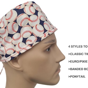 May include: A blue and white baseball-themed scrub hat with a red stitching detail. The hat has a tie back style. 4 STYLES TO CHOOSE: >CLASSIC TIE BACK >EURO/PIXIE >BANDED BOUFFANT >PONYTAIL