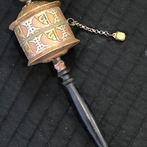 Vintage Tibetan prayer wheels. Hand-made brass and copper.