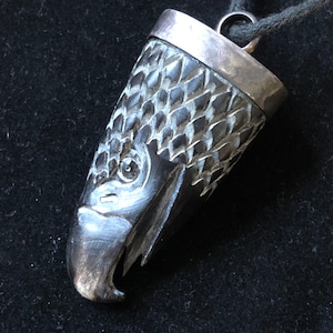 Carved bone Eagle pendant in silver hanger