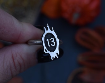 lucky 13 ring with spiky frame