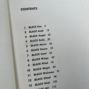May include: A black and white page with a list of chapter titles and page numbers. The list is titled "CONTENTS". The chapter titles are "BLACK Fire", "BLACK Gold", "BLACK Angel", "BLACK Bulls", "BLACK Mar&iacute;a", "BLACK Dance", "BLACK Sand", "BLACK Wings", "BLACK Wind", "BLACK Magic", "BLACK Welcome", "BLACK Ghost", "BLACK Heat", "BLACK Art", "BLACK Hours", and "BLACK Hunter".