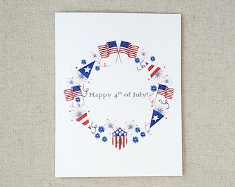 May include: A white card with a red, white, and blue patriotic design. The card features a wreath of American flags, fireworks, and blue flowers. The text "Happy 4th of July!" is written in the center of the card.