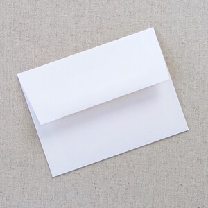 May include: A white envelope with a standard flap.