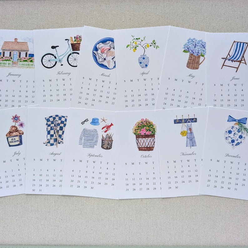 May include: A watercolor calendar featuring monthly illustrations. January shows a house, February a bicycle, March seashells, April a vase with lemons, May a basket of flowers, and June a beach chair. July shows ice cream, August a checkered pattern, September a nautical theme, October a flower basket, November an apron, and December an ornament.