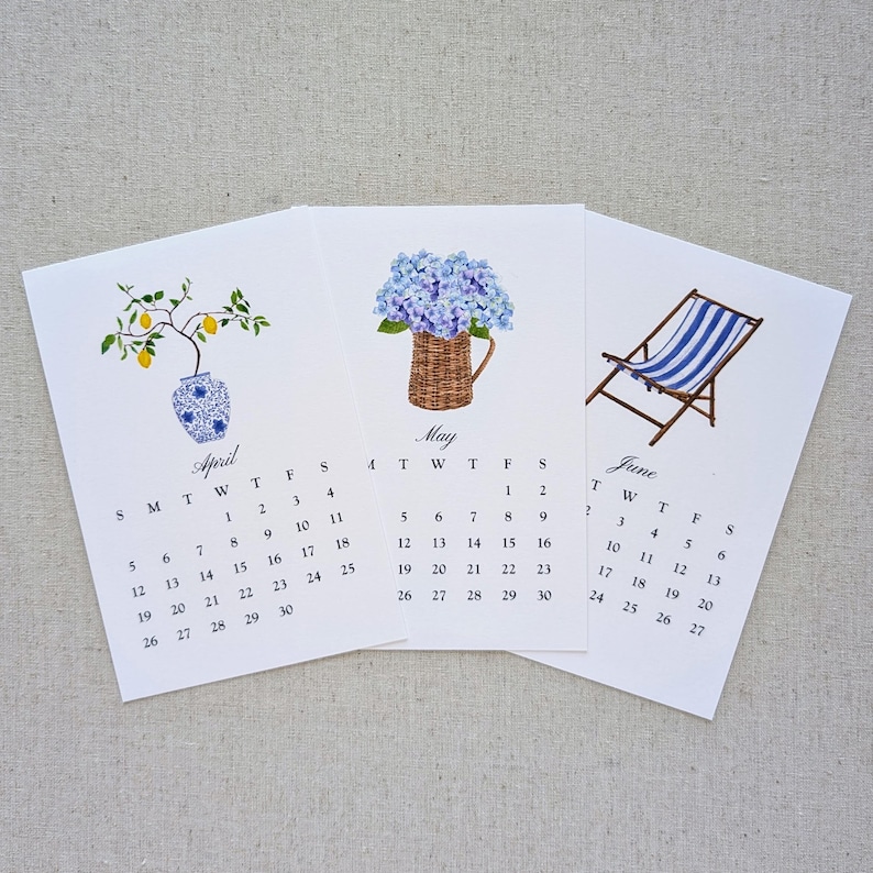 May include: Three-month calendar cards for April, May, and June. Each card features a watercolor illustration: a lemon tree in a vase, blue hydrangeas in a basket, and a blue-striped beach chair. The calendar dates are visible.