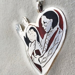 Mother Holding Cradle board Pendant