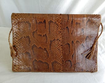 Oversized African snakeskin clutch