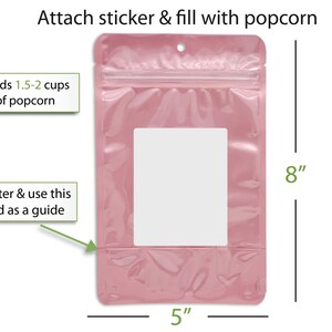 a pink plastic bag with a clear plastic window, and there are instructions on how to attach a sticker and fill it with popcorn.