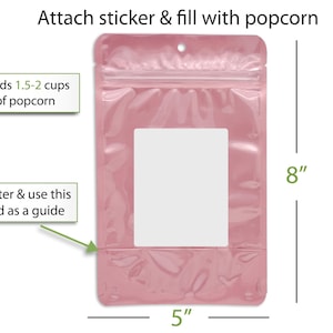a pink plastic bag with a clear plastic window, and there are instructions on how to attach a sticker and fill it with popcorn.