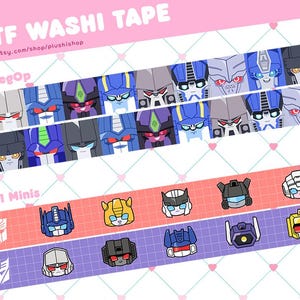 May include: Washi tape featuring colorful cartoon robot faces in rows. The tape includes the text "TF WASHI TAPE" and "etsy.com/shop/plushishop". The tape has a pink, red, and purple background with heart patterns.