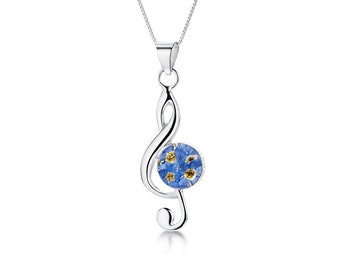 Treble clef musical note necklace with real forget-me-not flowers by Shrieking Violet. Sterling silver pendant + chain & giftbox.
