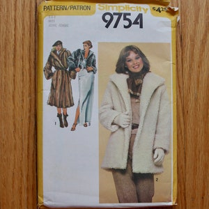 May include: Simplicity sewing pattern number 9754 for a coat. The pattern includes three different styles, one with a fur collar and two with a white fluffy collar. The pattern is for sizes 6-8, Miss/Petite.